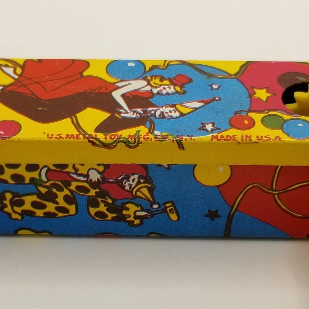 vintage tin lithograph ratchet style US Metal Toy Co noisemaker party theme